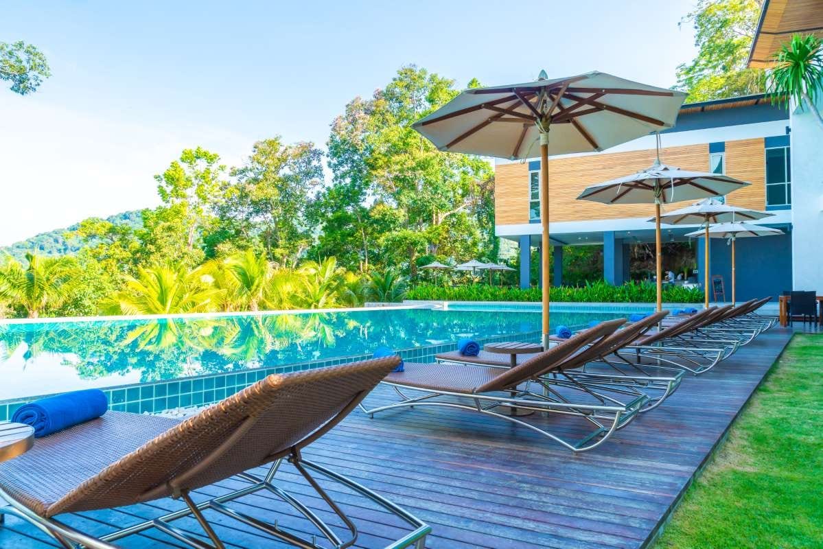 Umbrella chair beside a swimming pool at a hotel resort