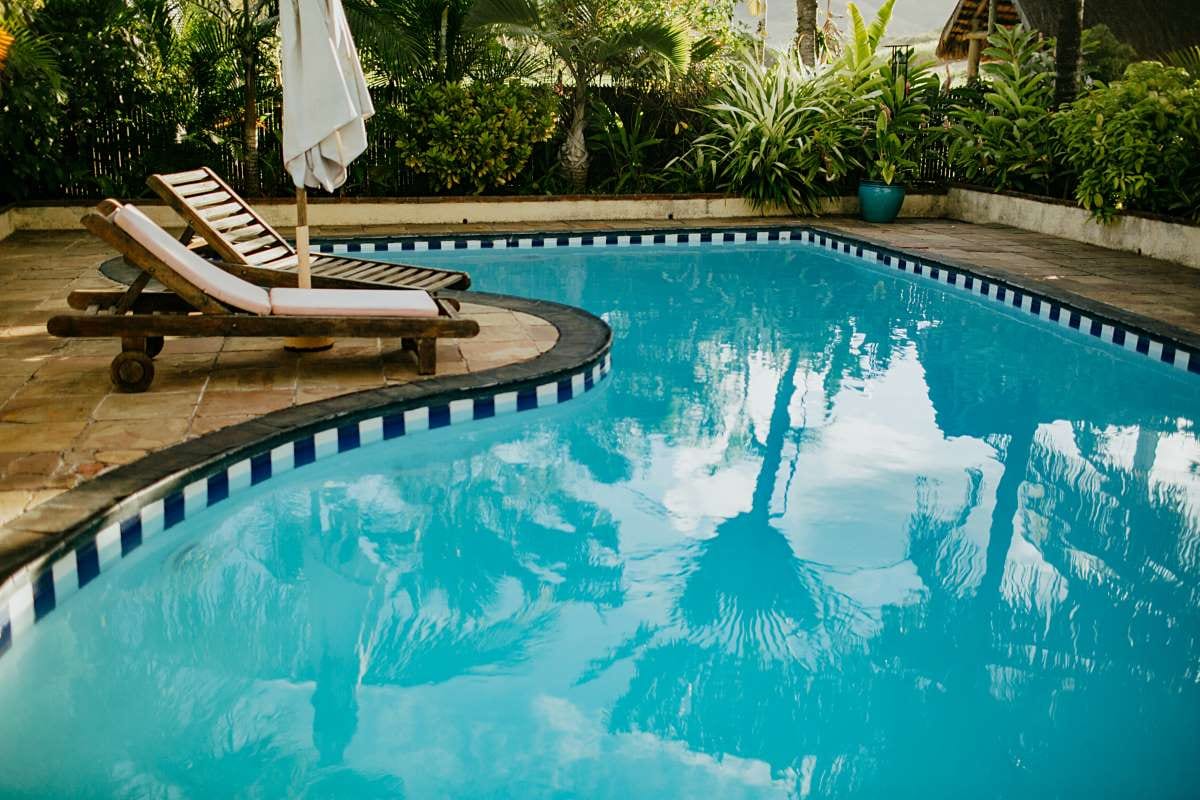 High angle view of a swimming pool and backyard yard