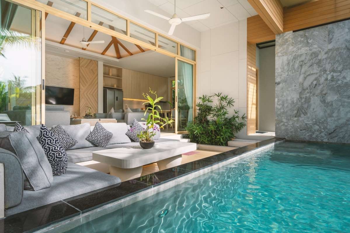 Luxury villa interior with indoor pool and living room design