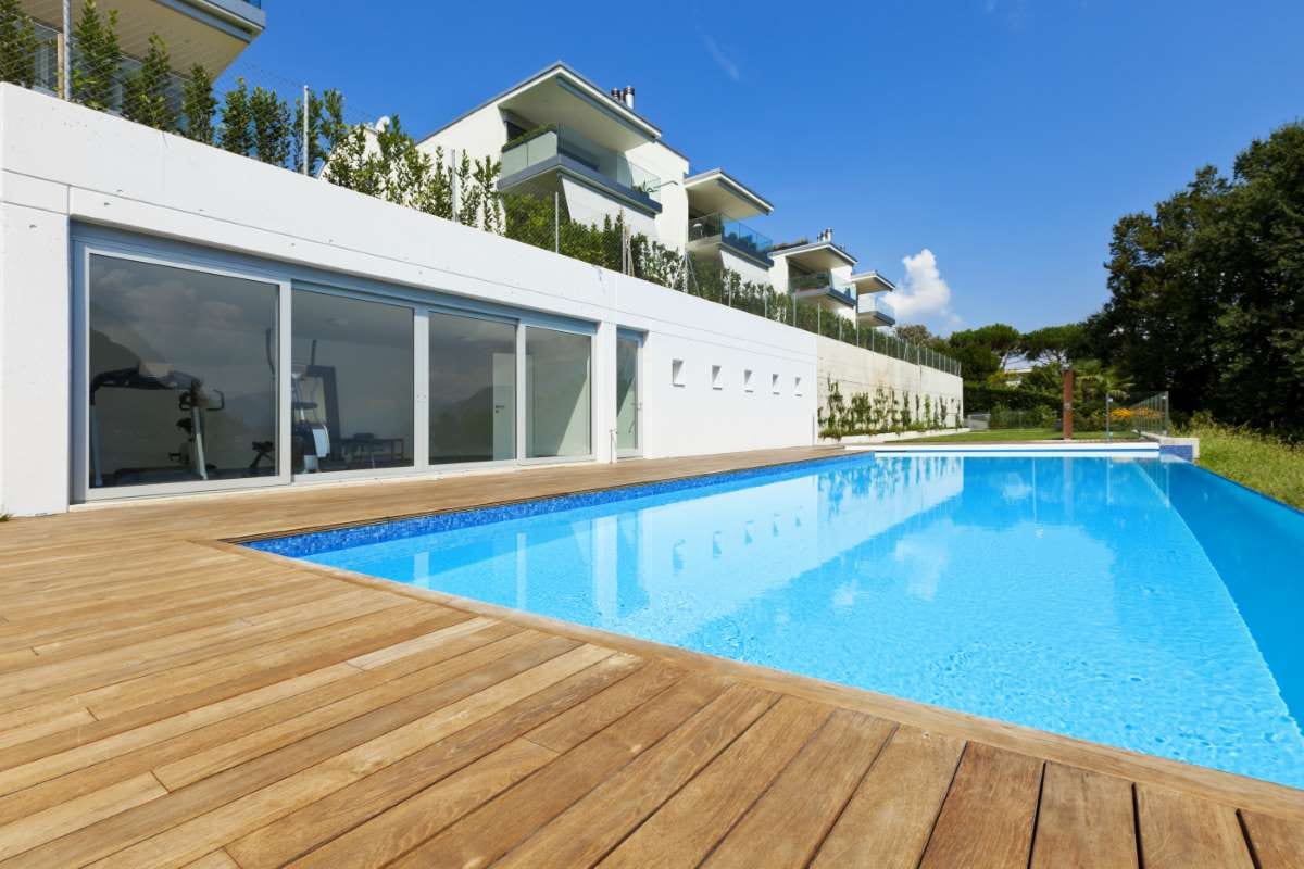Backyard pool beside a house, reflecting the role of transparency in employee development
