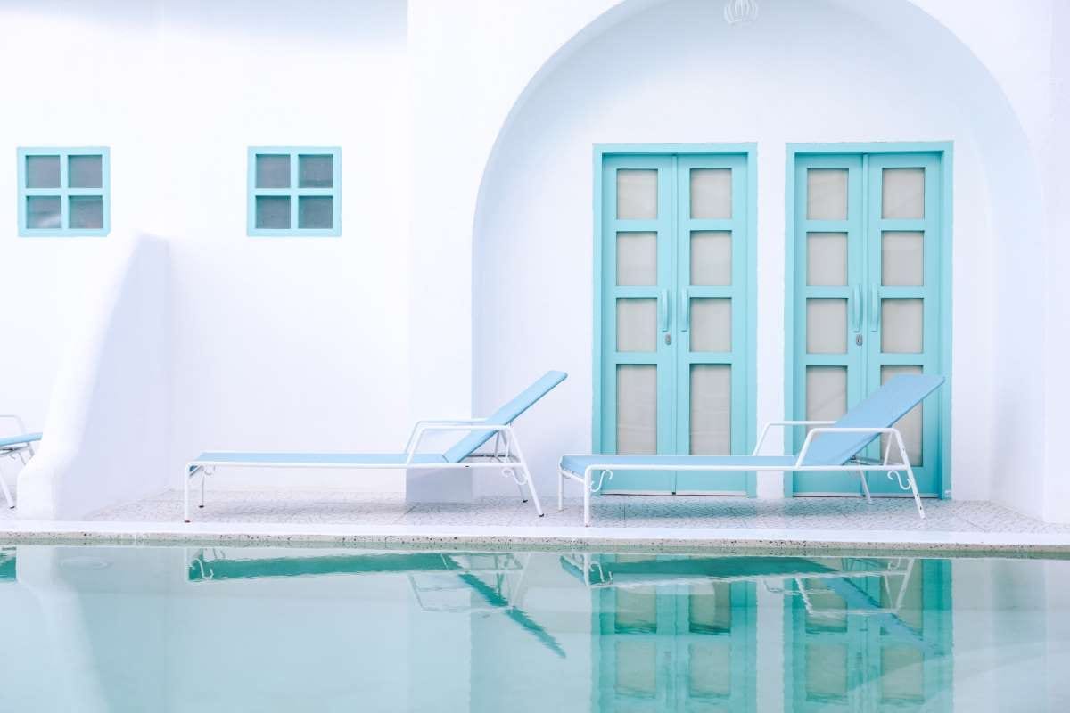 Relaxing chair beside a pool, suggesting a calm customer communication workspace