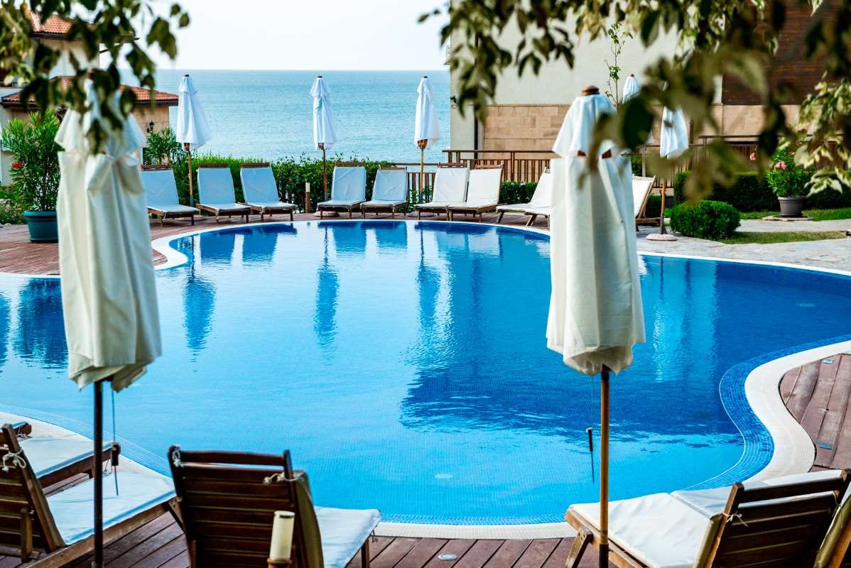 Swimming pool by the sea in morning light