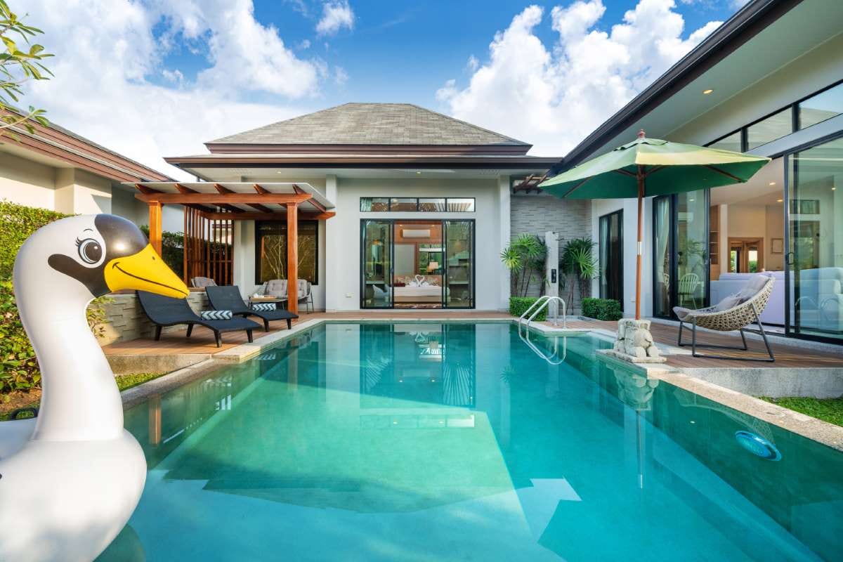 Swimming pool beside a tropical garden villa