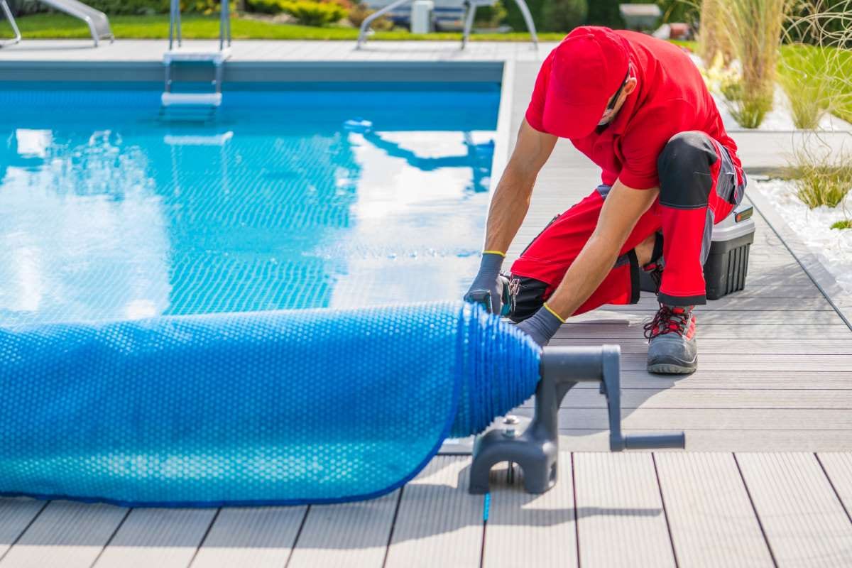Technician finishing pool deck installation