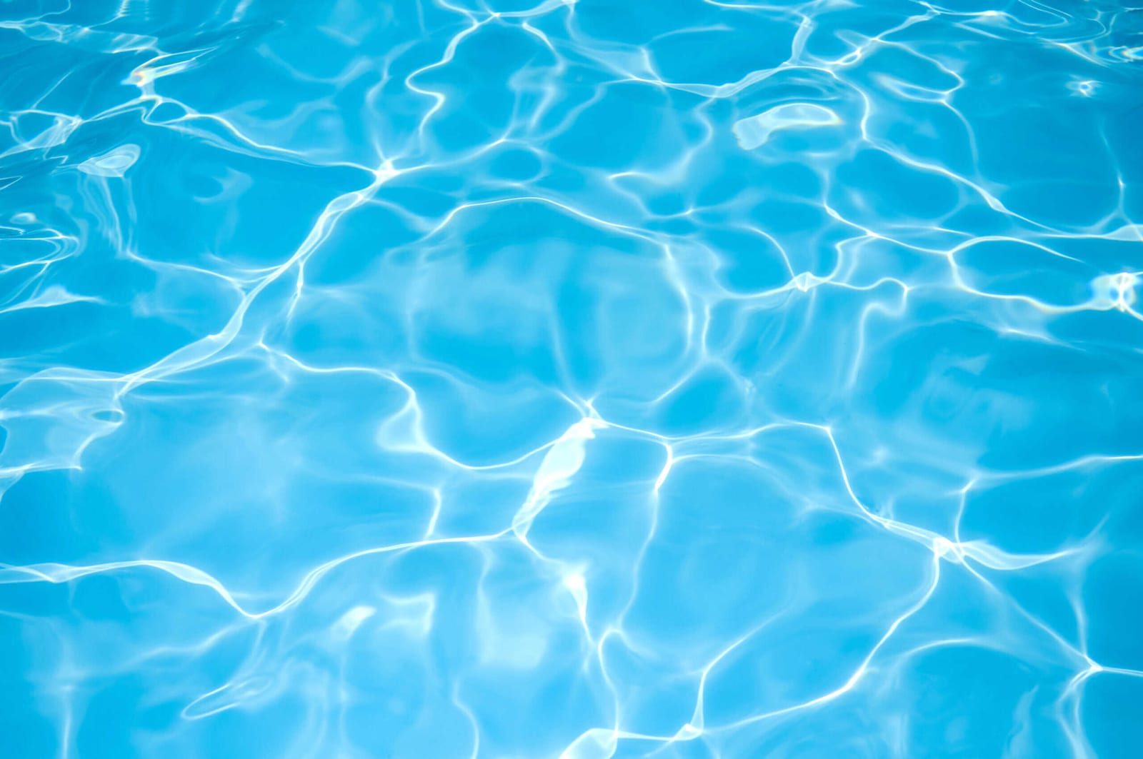 Water ripple pattern across a swimming pool surface